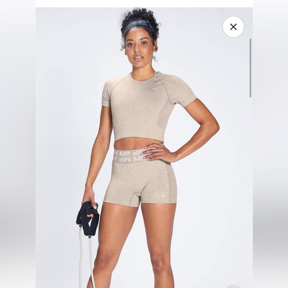 My Protein MP crop top, sports bra, and shorts tan color